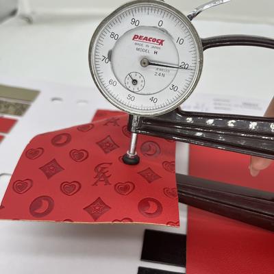 Tissu en cuir synthétique pressé en PU pour sac à chaussures